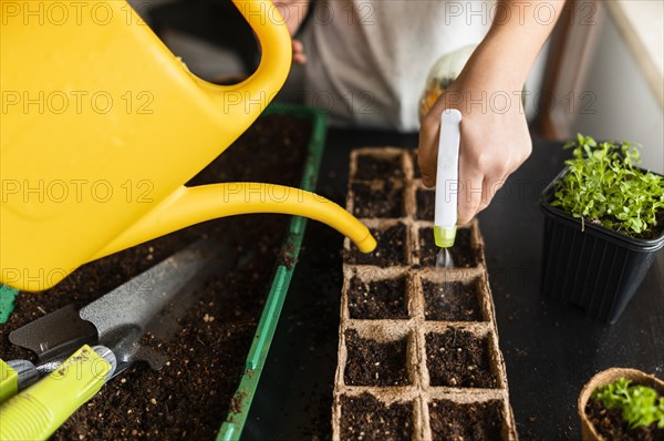 Children watering crops home