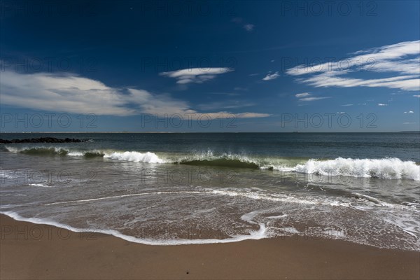 Listening to the ocean waves on a sunny spring day on the Brighton Beach