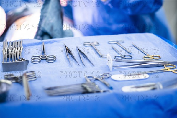 Operating table with surgical cutlery during an operation in a hospital