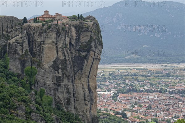 The Meteora Monastery Agia Triada Holy Trinity. The Greek Orthodox Meteora monasteries are built on sandstone cliffs above the Pinios valley. They are a UNESCO World Heritage Site. Kalambaka