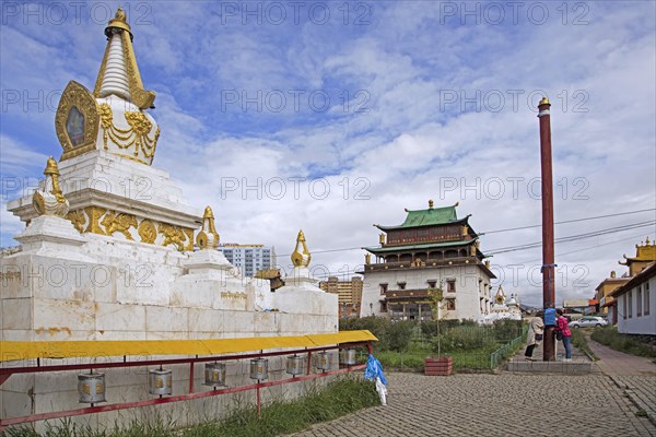 Stupa and Mongolians praying at pole