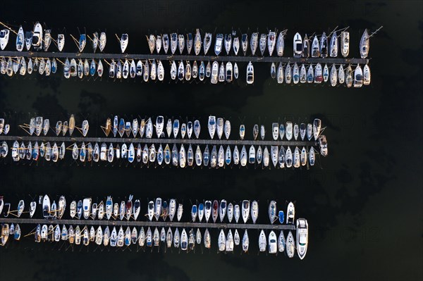 Aerial view over jetties with sailing boats at marina in harbour of Heiligenhafen along the Baltic Sea