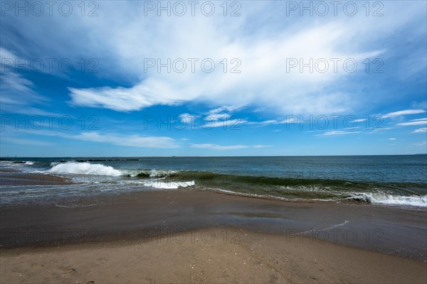 Listening to the ocean waves on a sunny spring day on the Brighton Beach