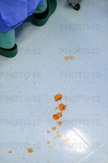 Blood spatter on the floor of an operating theatre in a hospital