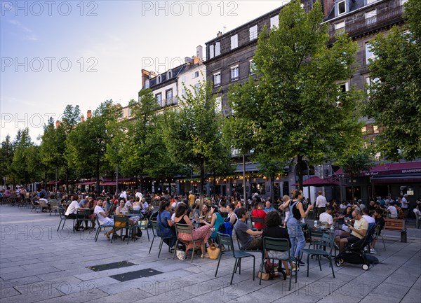 People enjoying the summer in street cafes and restaurants