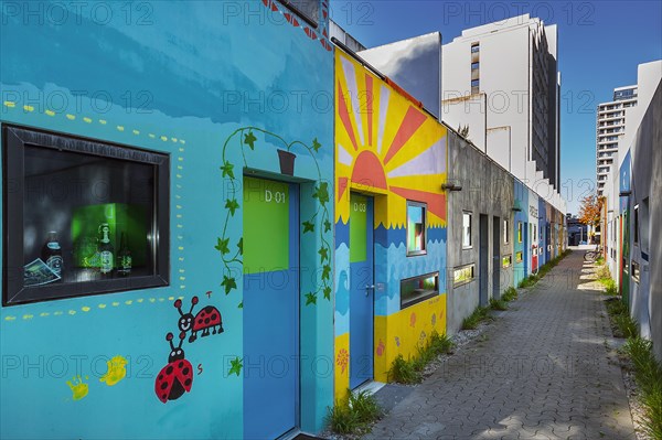 Olympic Village with painting on the former bungalows of the student village