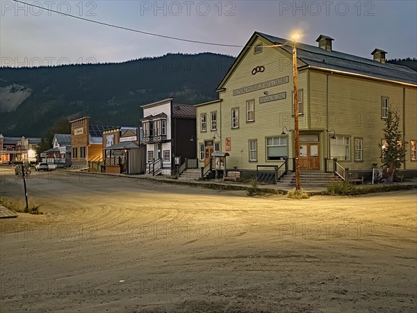 Historic wooden houses and wooden boardwalks in the gold mining town of Dawson City