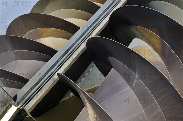 Modern Archimedes screws of pumping station used to drain the polders at Kinderdijk in Holland