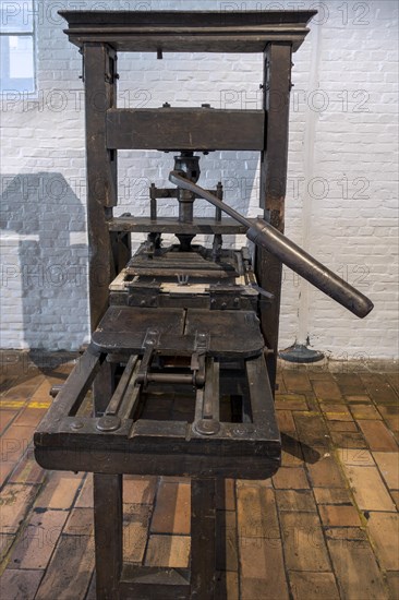 18th century wooden printing press with metal screw for relief printing using Blaeu mechanism