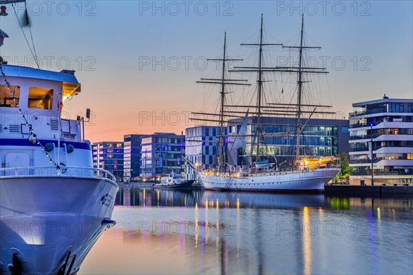 Excursion ship and sail training vessel Germany in the New Harbour at dusk