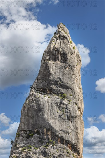 Climbers on the rock needle L'Aguglia at Cala Goloritze