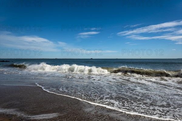 Listening to the ocean waves on a sunny spring day on the Brighton Beach