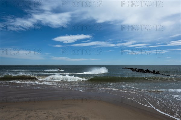 Listening to the ocean waves on a sunny spring day on the Brighton Beach