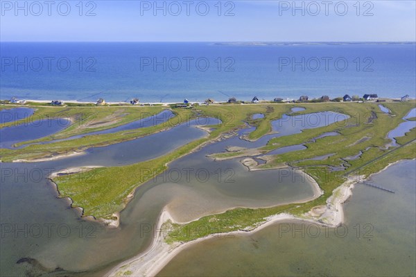 Aerial view over houses on the shore along the Baltic Sea coast at Steinwarder peninsula