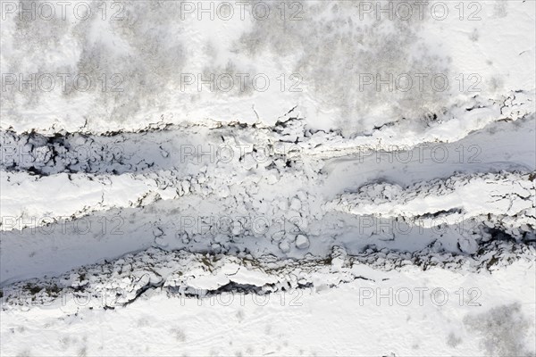 Aerial view over the Almannagja Canyon in the snow in winter