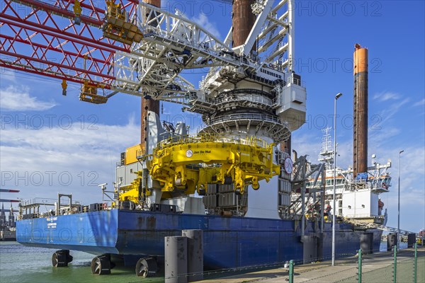 Offshore jack-up installation vessel Vole Au Vent with crane for assembling wind turbines moored at REBO heavy load terminal in Ostend port