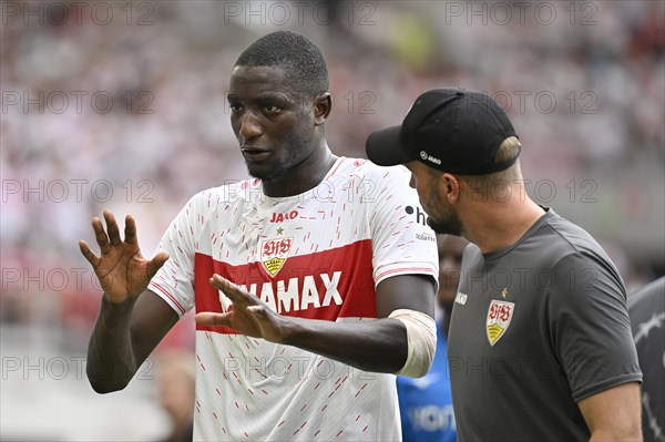 Coach Sebastian Hoeness VfB Stuttgart talking to Serhou Guirassy VfB Stuttgart