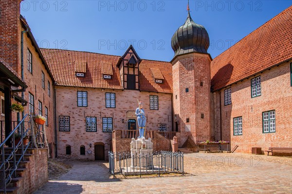 Inner courtyard with Roland statue of Bederkesa Castle in the mud spa