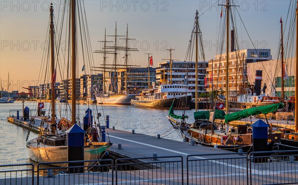 Historic icebreaker Whale and sail training ship Germany in the New Harbour in the evening sun