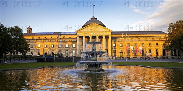 Spa hotel and Casino in late evening light with cascade fountain