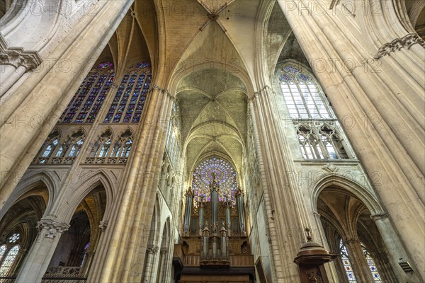 Church organ and rose window in the interior of Saint-Gatien Cathedral in Tours