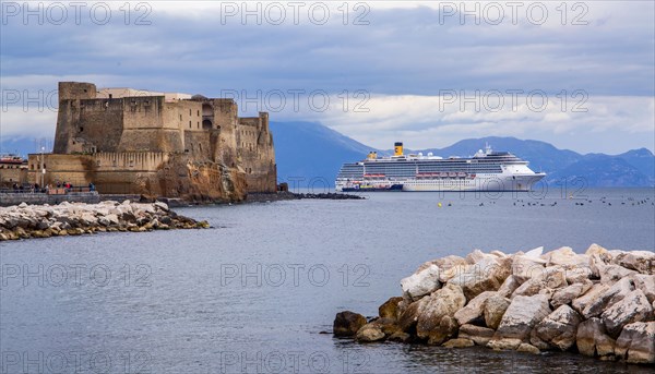 Castel dell'Ovo by the sea with cruise ship. Naples