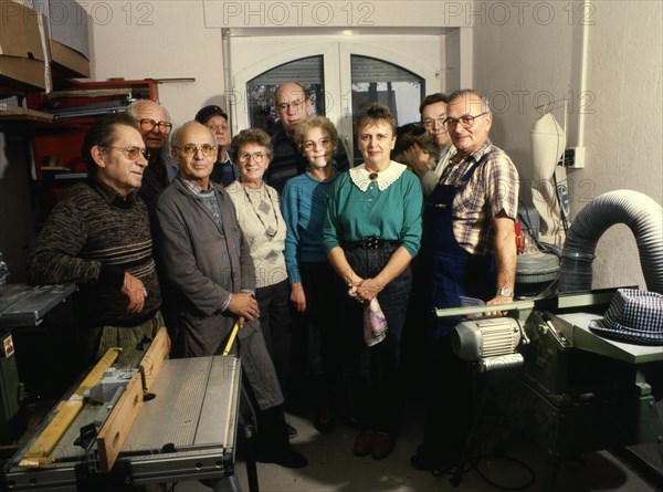 Group of pensioners produces toys for children. 80s