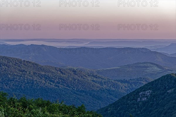 Daybreak over the mountain landscape of the Balkan Mountains and the forested slopes of the Balgarka nature park Park in Central Bulgaria. Shipka