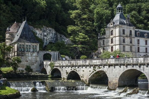 The Benedictine abbey abbaye Saint-Pierre de Brantome and bridge over the river Dronne