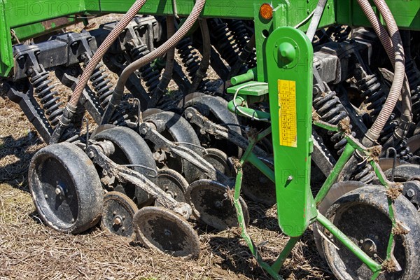 Close up of John Deere 750A no-till seed drill working on farmland