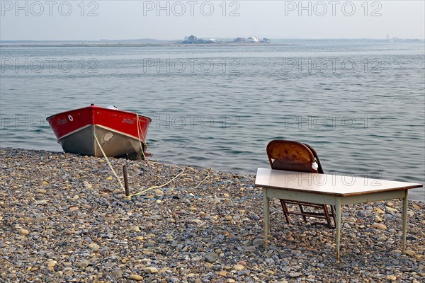 Small boat and table on Tuktojaktuk beach