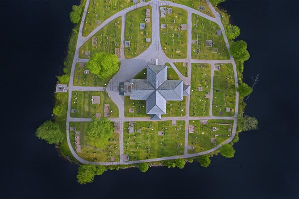 Aerial view over the red wooden Raemmens kyrka