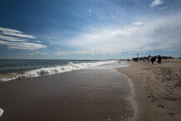 Listening to the ocean waves on a sunny spring day on the Brighton Beach