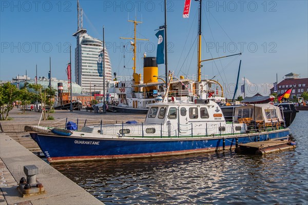 Historic ships in the New Harbour with the Atlantic Sail City Hotel