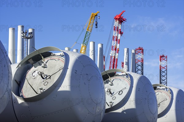 Wind turbine nacelles with rotor hubs for offshore SeaMade wind farm at REBO heavy load terminal in Ostend port