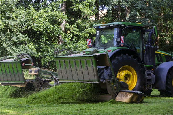 Grass mowing in a small field near Waldheim with a John Deere tractor