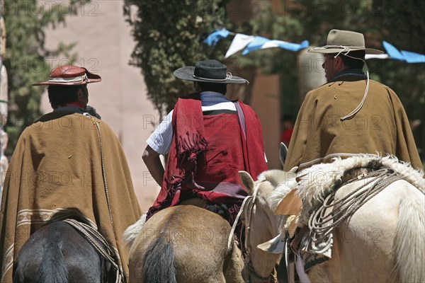 Gauchos on horseback in the Quebrada de Humahuaca