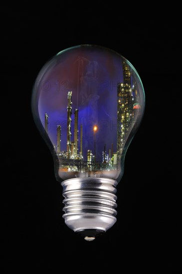 Lightning during thunderstorm above petrochemical industry inside incandescent lamp