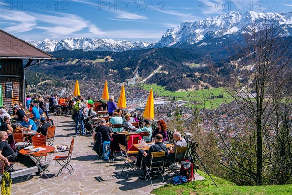 Sun terrace of the Martinshuette with view of the valley