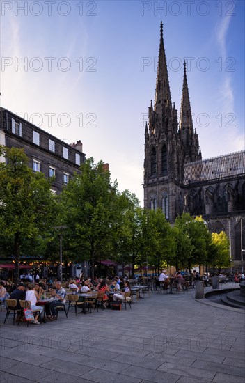 People enjoying the summer in street cafes and restaurants