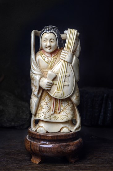 Chinese ivory woman figure with mandolin