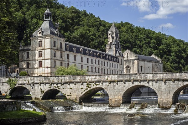 The Benedictine abbey abbaye Saint-Pierre de Brantome and its bell tower along the river Dronne