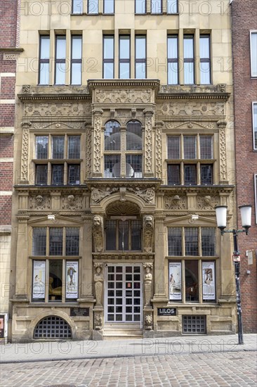 Beautiful facade with entrance portal in neo-baroque style in the street Drubbel