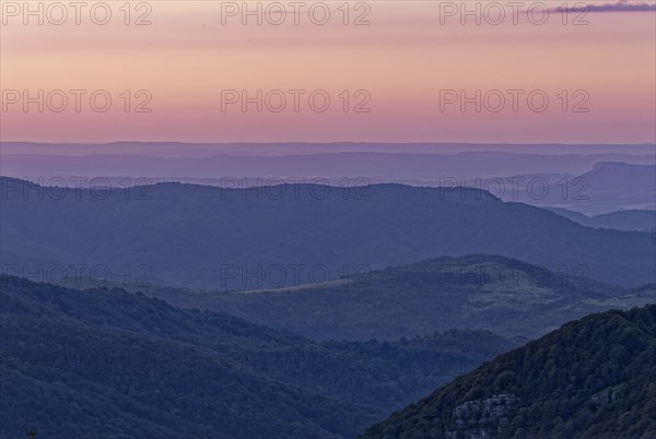 Evening mood over the mountain landscape of the Balkan Mountains and the forested slopes of the Balgarka nature park Park in Central Bulgaria. Shipka
