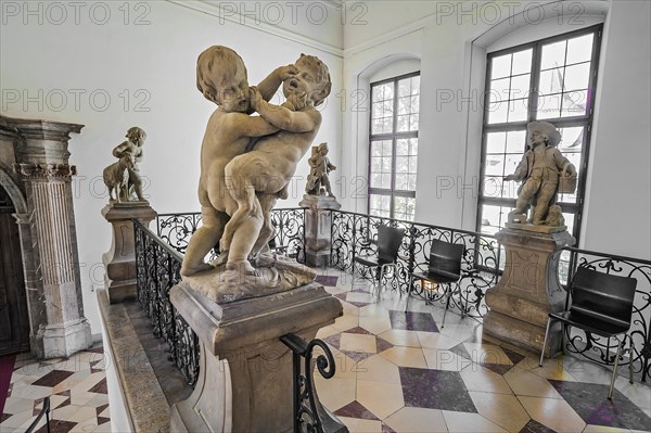 Child fighting with juvenile satyr