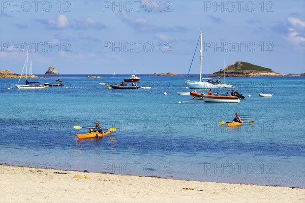 Kayakers and boats off the coast