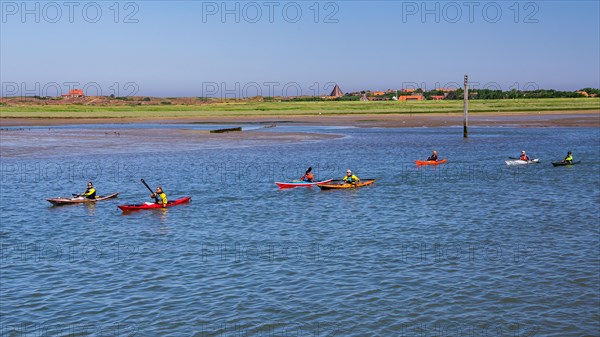 Kayakers in front of the island