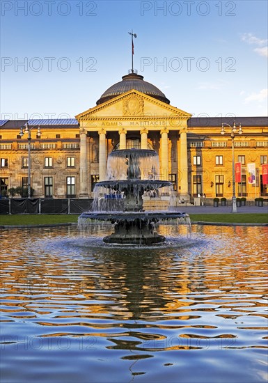 Spa hotel and Casino in late evening light with cascade fountain