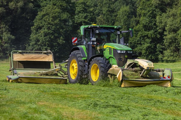 Grass mowing in a small field near Waldheim with a John Deere tractor