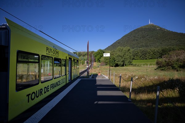Bottom station of the Panoramique des Domes rack railway in Tour de France 2023 all-car advertising driving up Puy de Dome